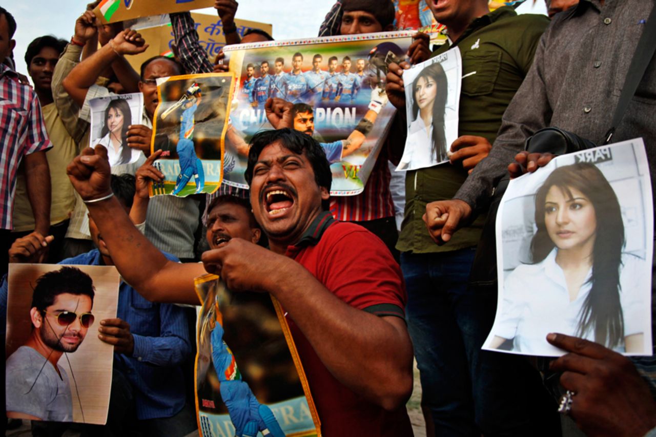 People in Ahmedabad shout slogans against Virat Kohli and Anushka Sharma following India's semi-final defeat in the World Cup, March 26, 2015