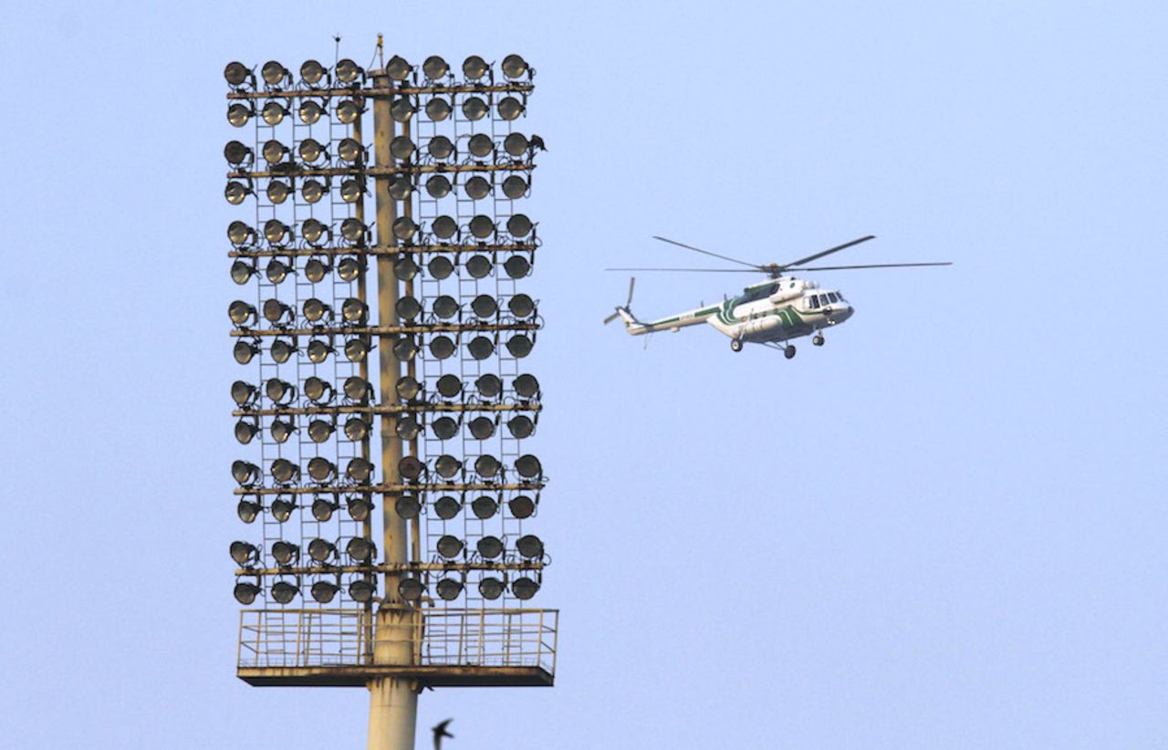A surveillance chopper hovers over the Gaddafi stadium during Zimbabwe training, Lahore, May 19, 2015