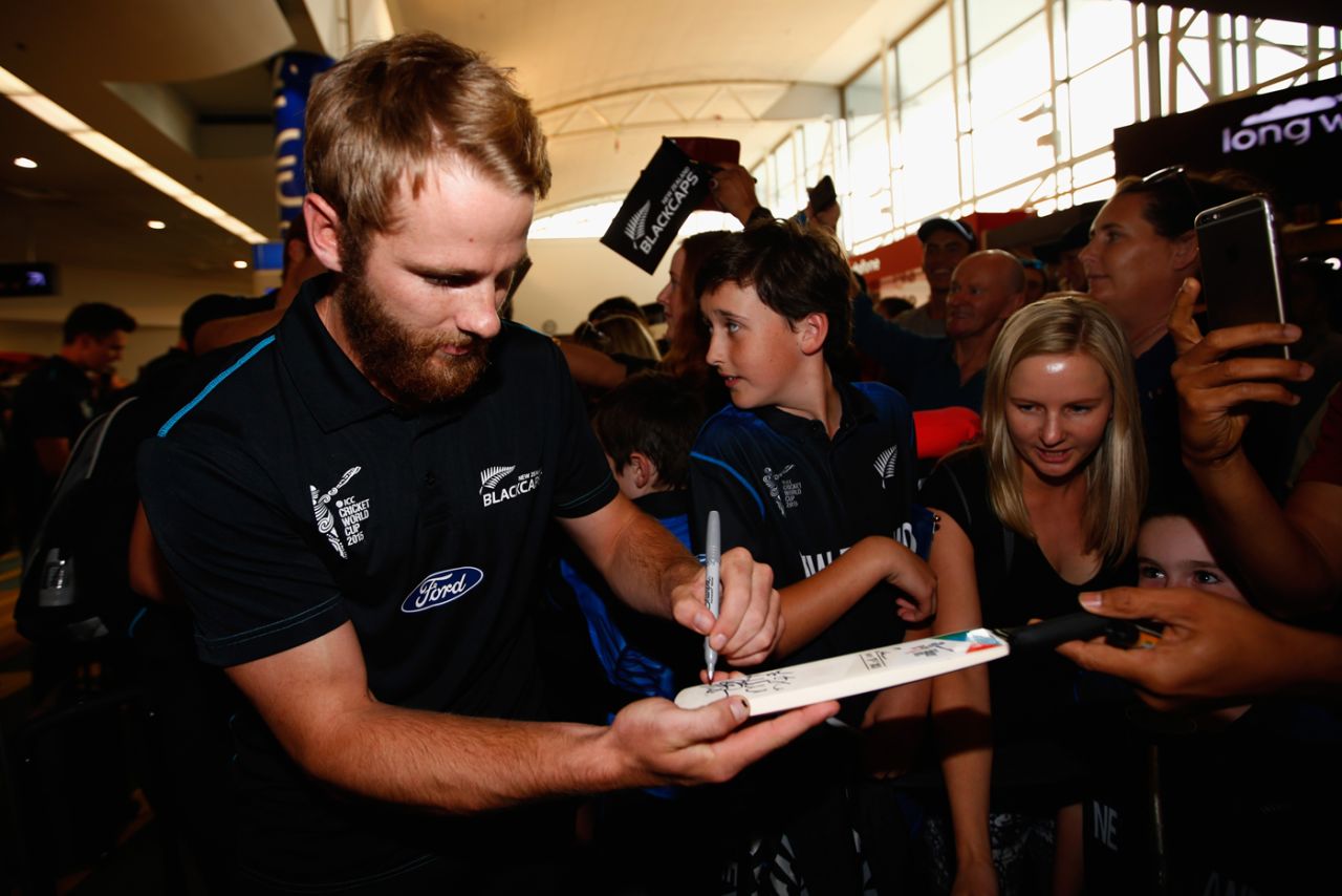 Kane Williamson signs autographs at Auckland airport on the New Zealand team's return from the World Cup final, March 31, 2015