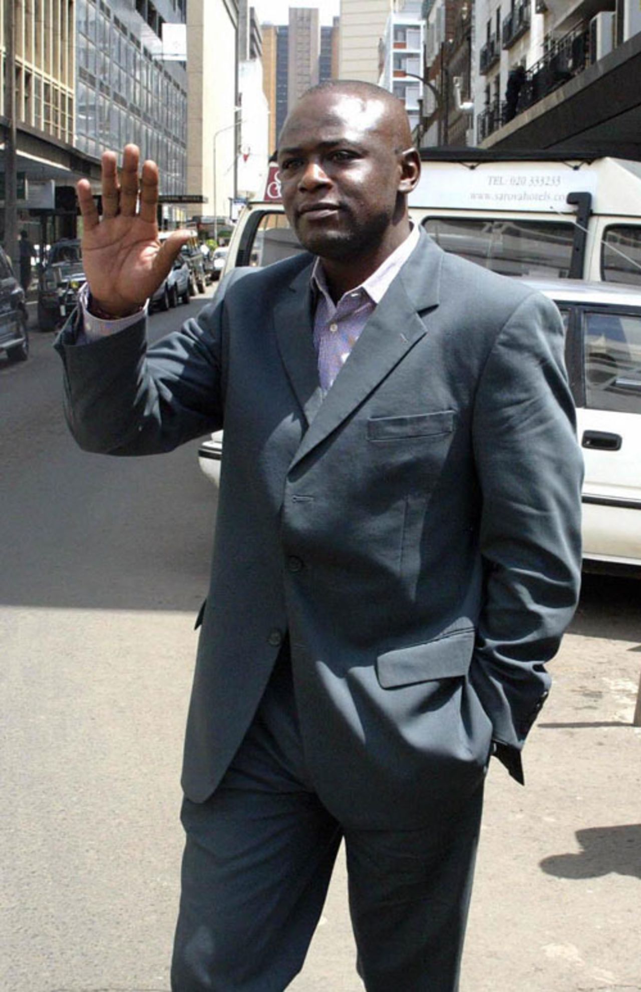 Maurice Odumbe arrives for his hearing at a Nairobi hotel, May 19, 2004
