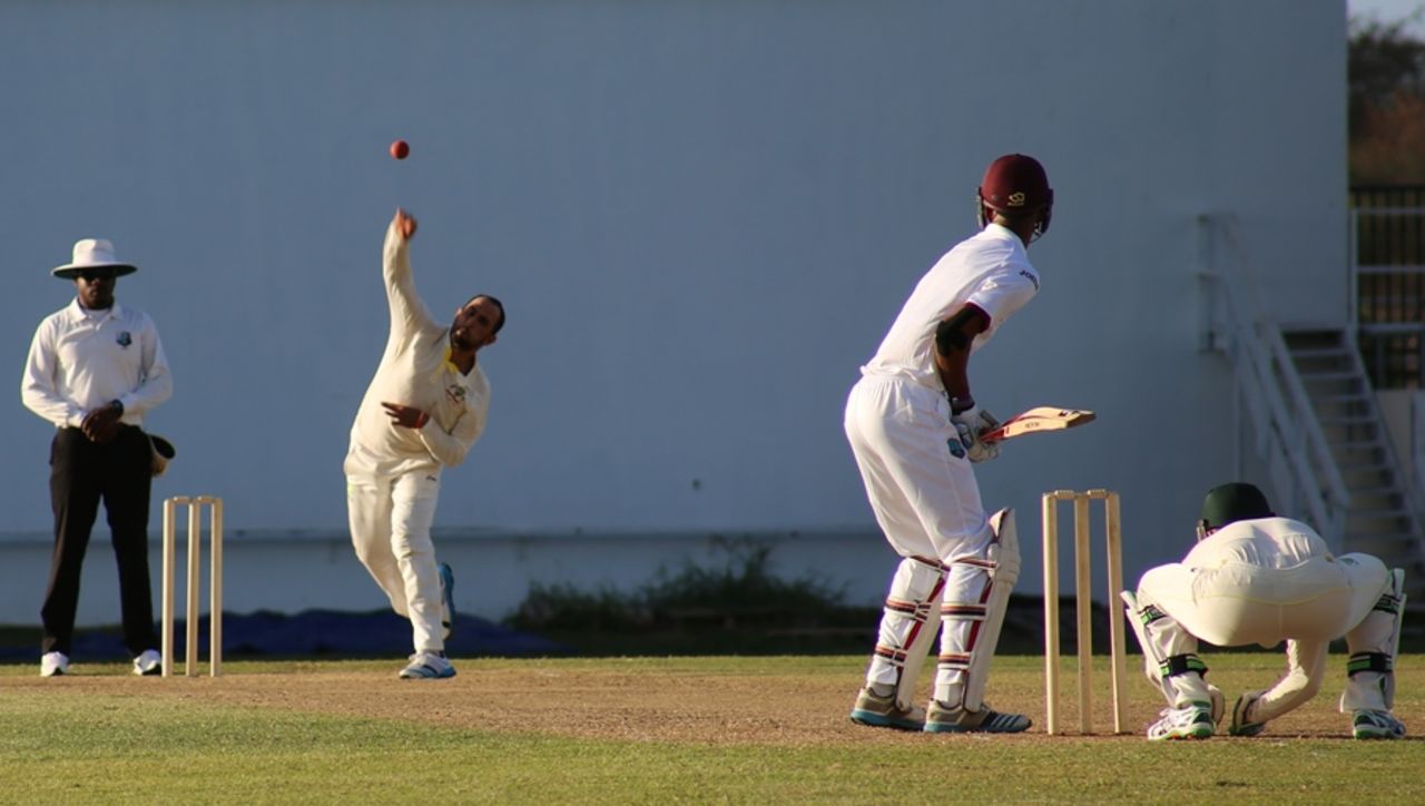 Fawad Ahmed sends down a delivery to Roston Chase, WICB President's XI v Australians, Antigua, 1st day, May 27, 2015