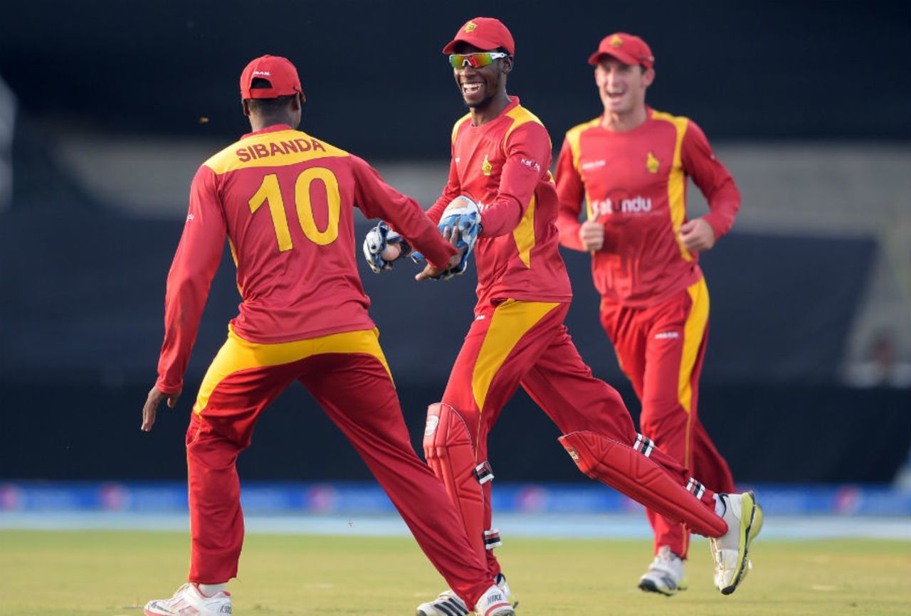 Richmond Mutumbami and Vusi Sibanda celebrate a wicket, Pakistan v Zimbabwe, 3rd ODI, Lahore, May 31, 2015