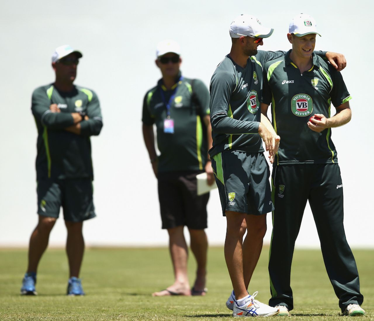Nathan Lyon congratulates Adam Voges after being informed of his selection in the XI, Roseau, June 2, 2015