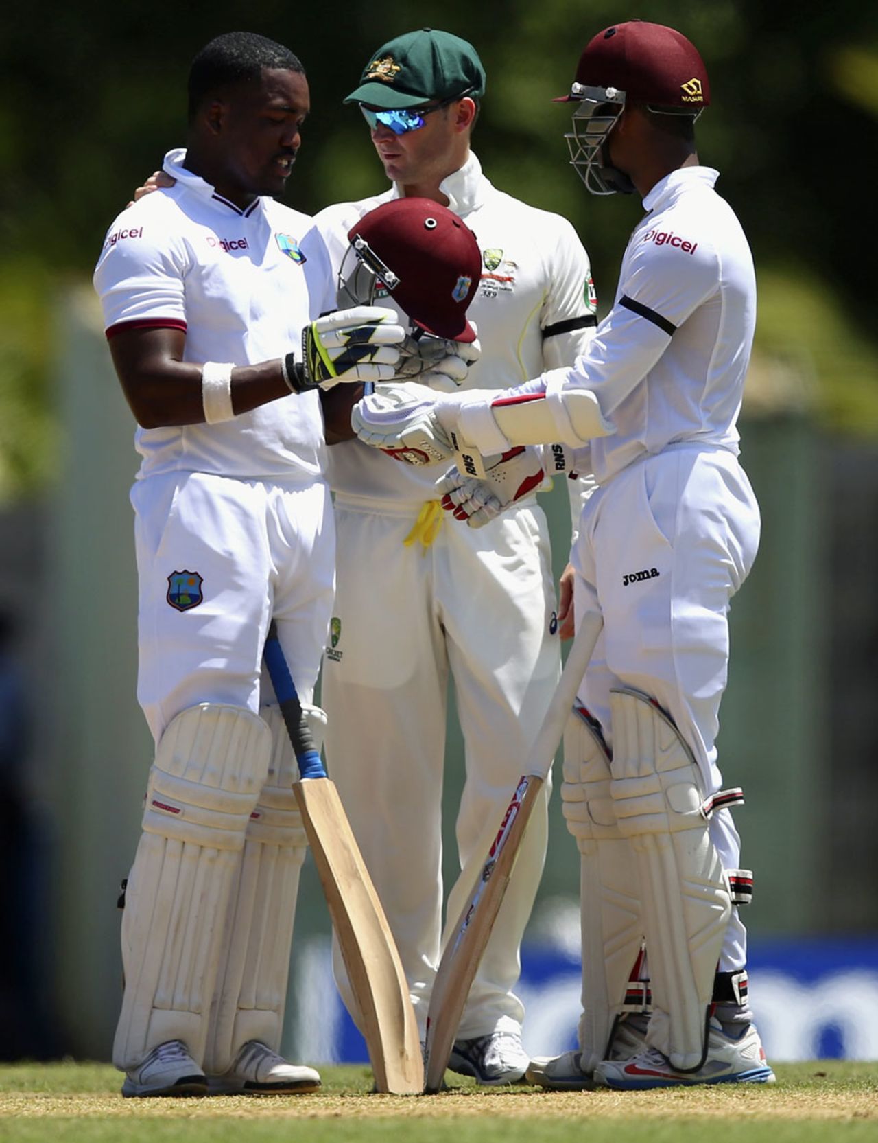 Michael Clarke checks on Darren Bravo after the latter was struck on the side of the helmet , West Indies v Australia, 1st Test, 1st day, Roseau, June 3, 2015