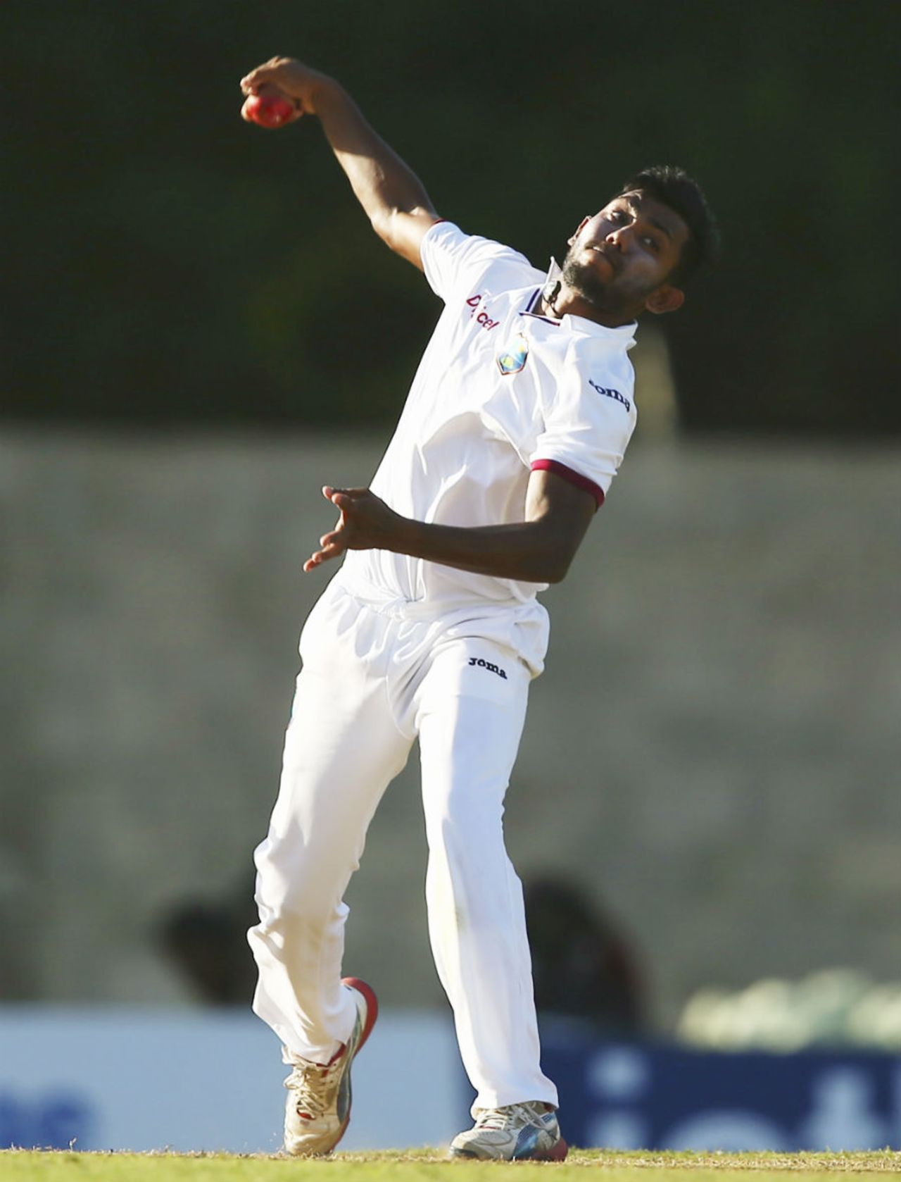 Devendra Bishoo prepares to deliver the ball, West Indies v Australia, 1st Test, 1st day, Roseau, June 3, 2015