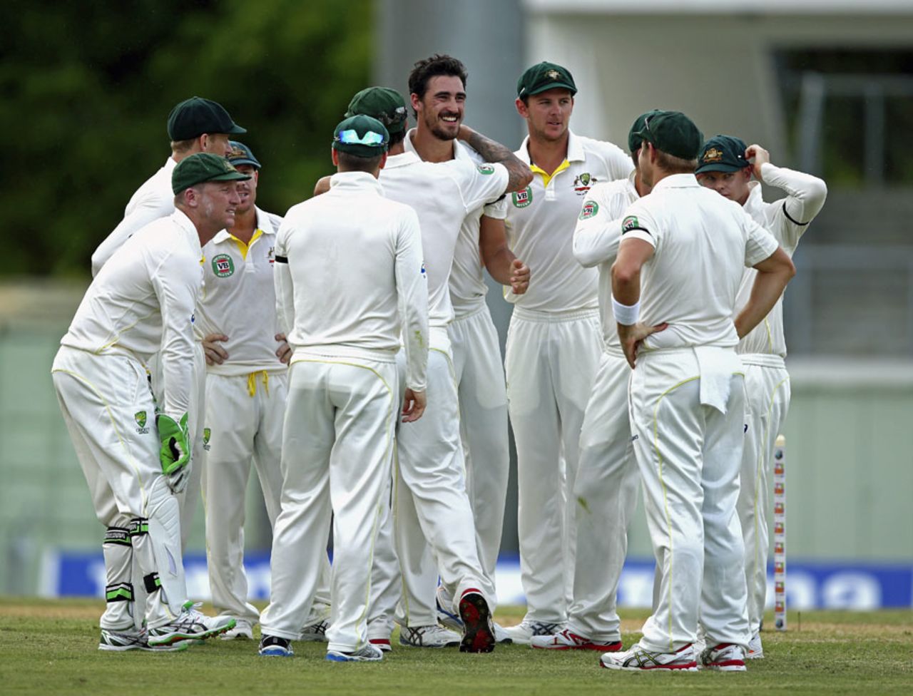 The Australia team gather around Mitchell Starc after Kraigg Brathwaite's dismissal, West Indies v Australia, 1st Test, Roseau, 2nd day, June 4, 2015