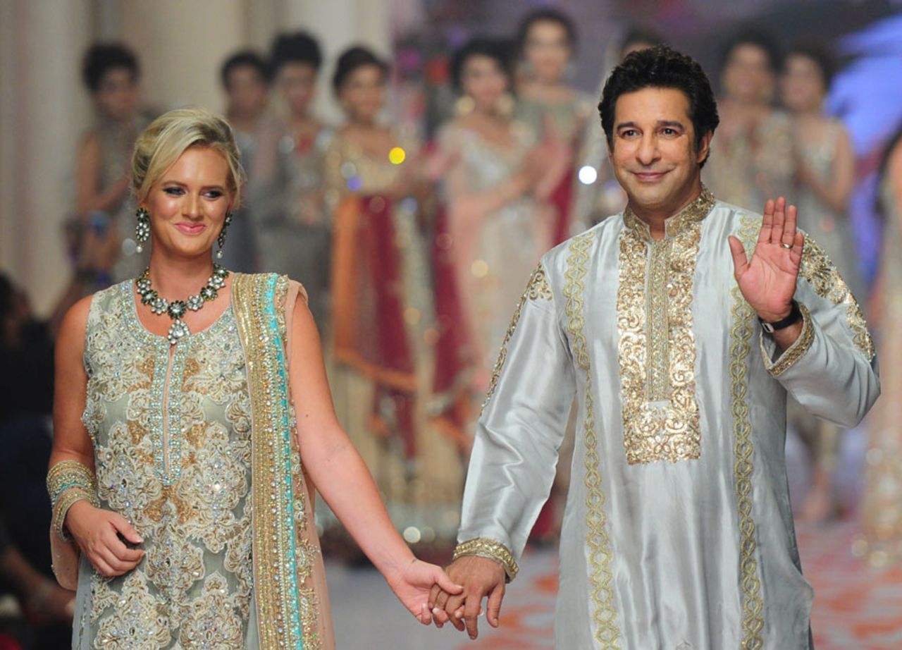 Wasim Akram with his wife Shaniera at the Bridal Couture Fashion Week in Karachi, Karachi, June 8, 2015