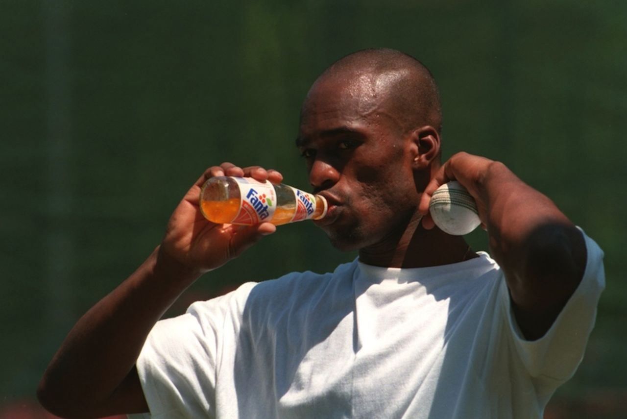 Chris Lewis takes a sip from a soft drink, January 9, 1995