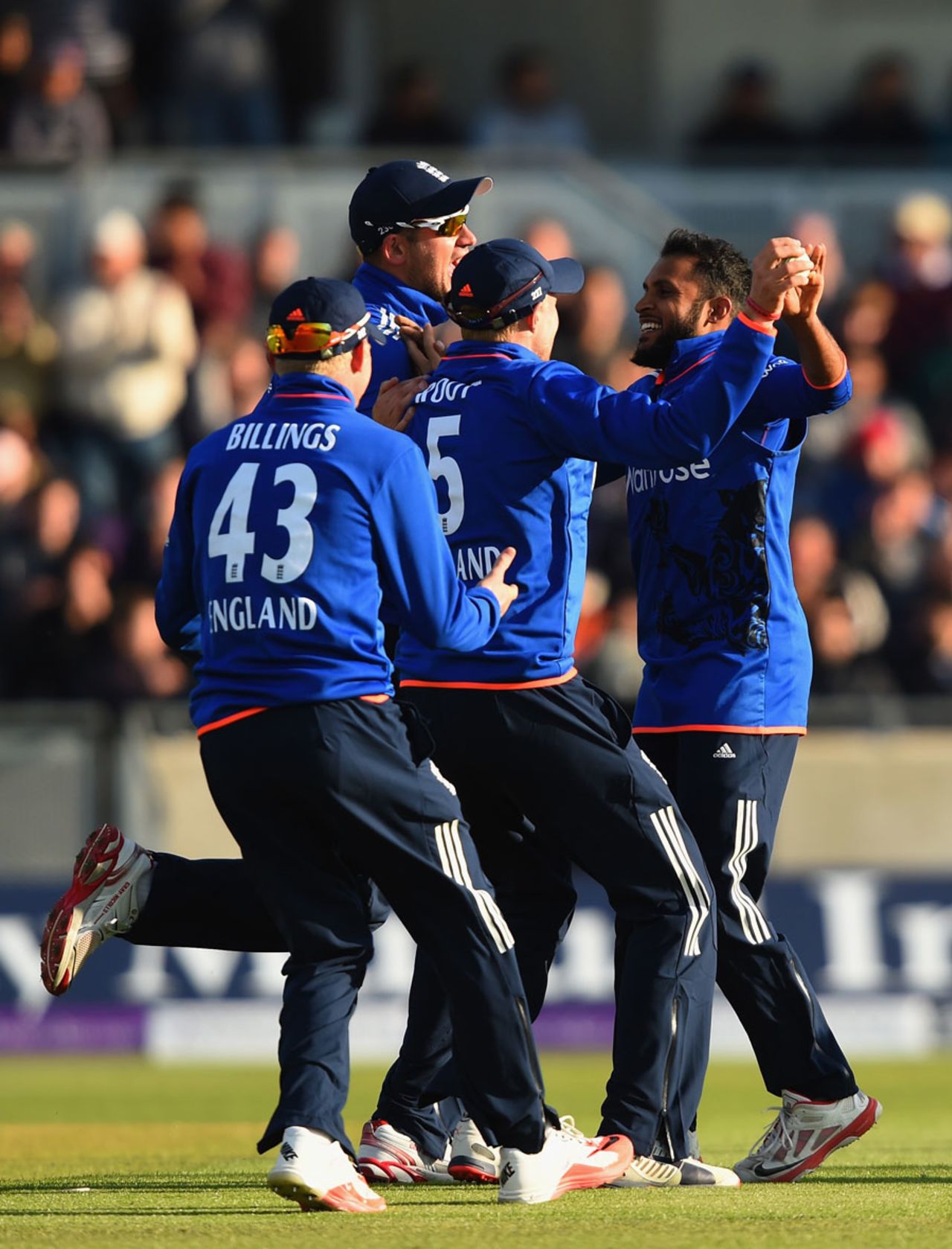 Adil Rashid is mobbed after taking one of his four wickets, England v New Zealand, 1st ODI, Edgbaston, June 9, 2015