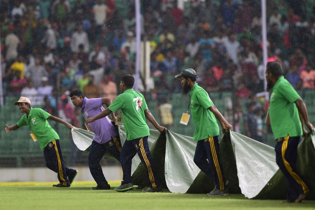 The covers are brought on after rain halted play, Bangladesh v India, only Test, Fatullah, 1st day, June 10, 2015 