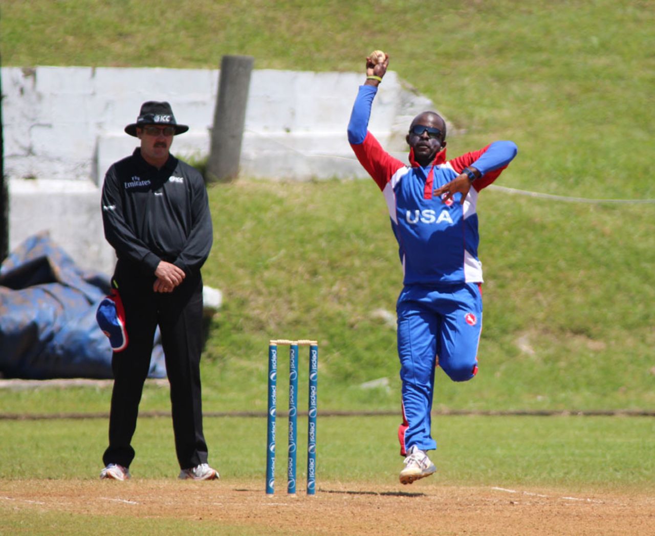 Orlando Baker bounds in with his medium pace, Uganda v United States of America, World Cricket League Division 3, St David's, May 2, 2013
