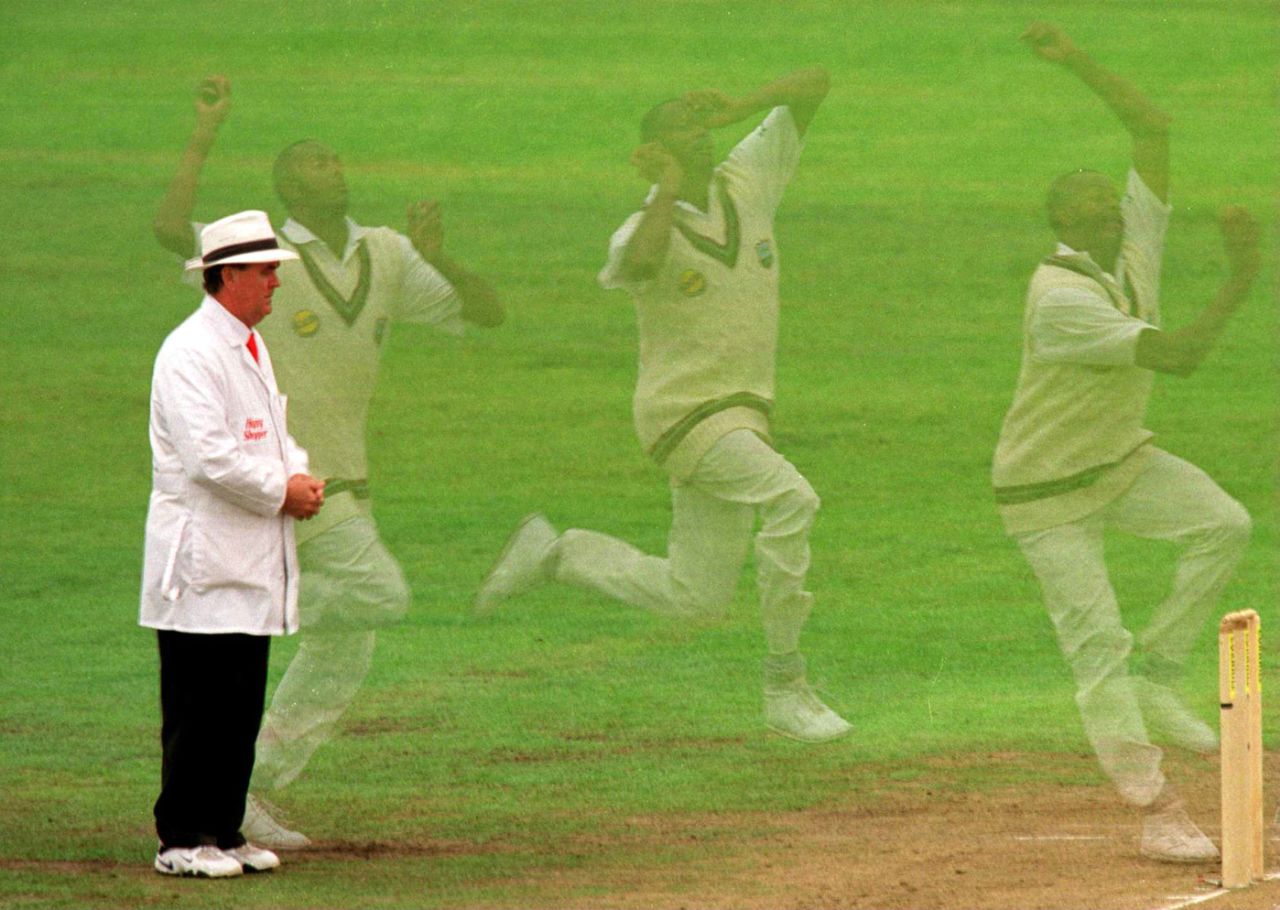 Courtney Walsh speeds past umpire Doug Cowie, England v West Indies, 3rd Test, Old Trafford, 5th day, August 7, 2000