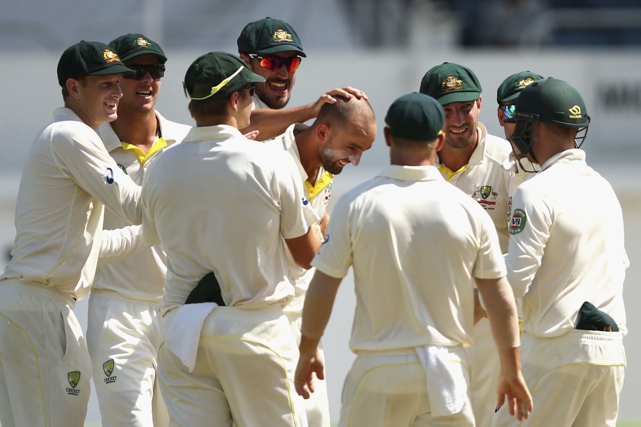 Nathan Lyon is swarmed after taking the wicket of Darren Bravo, West Indies v Australia, 2nd Test, 2nd day, Kingston, June 12, 2015