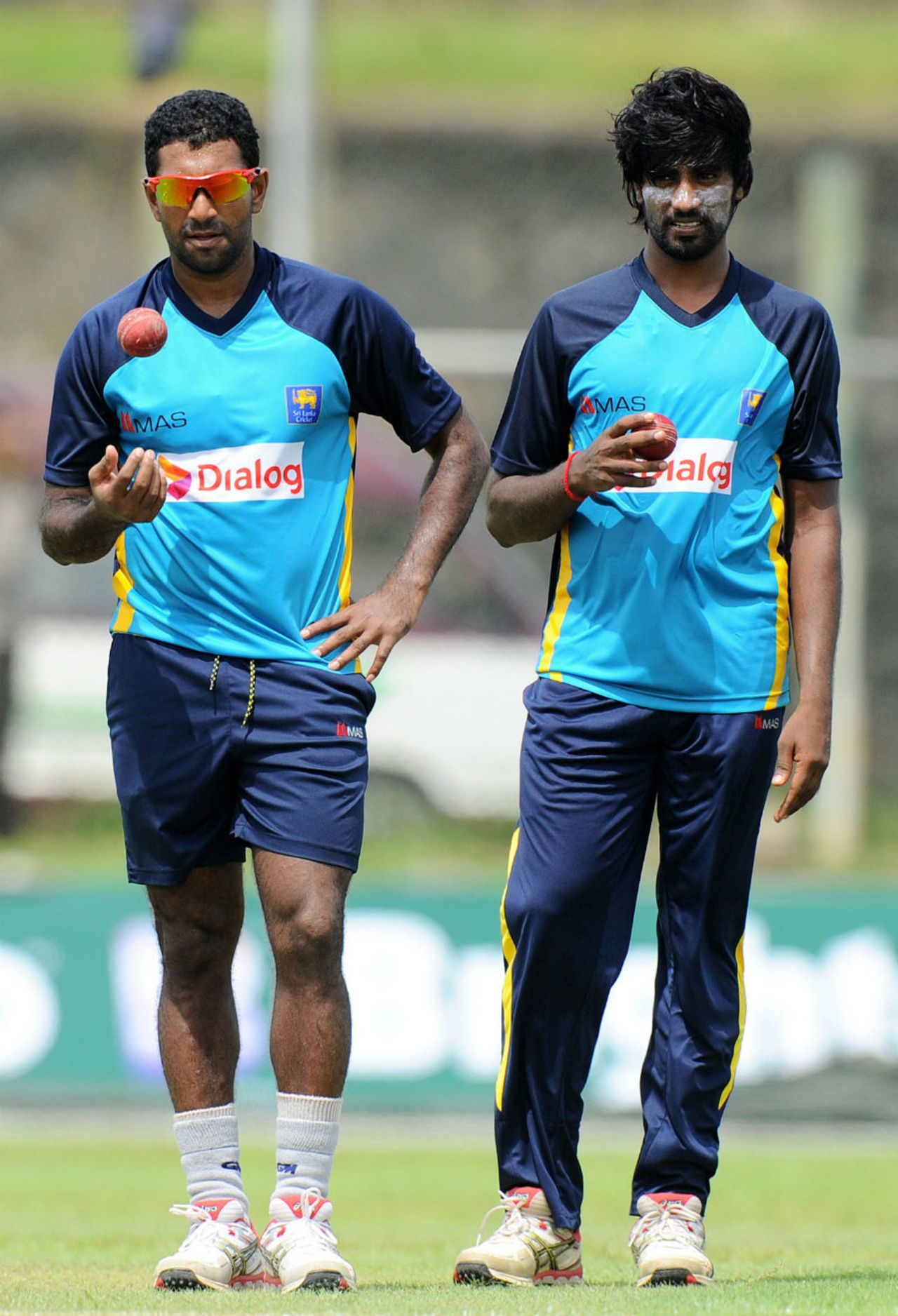 Dhammika Prasad and Nuwan Pradeep wait for their turn to bowl, Galle, June 16, 2015