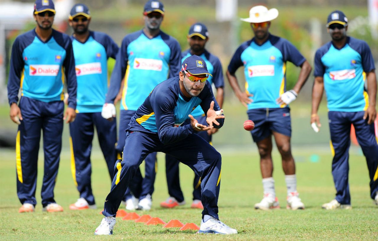 That's how it's done boys: Kumar Sangakkara takes catches as his team-mates watch on, Galle, June 16, 2015