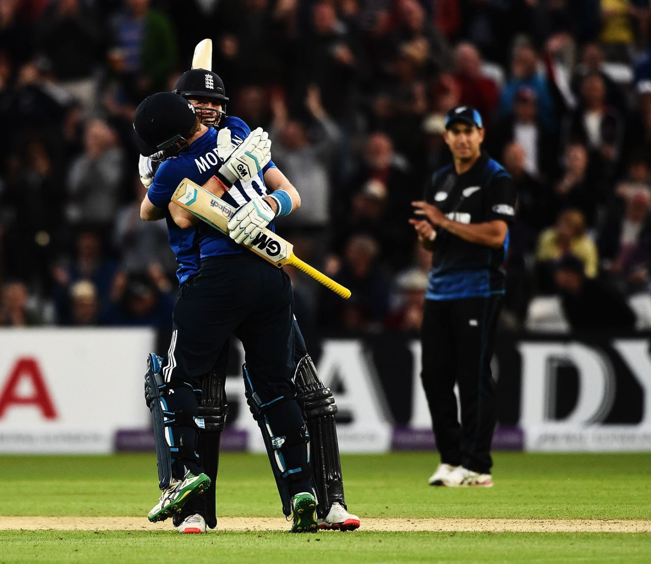 Eoin Morgan gets a hug from Joe Root, England v New Zealand, 4th ODI, Trent Bridge, June 17, 2015