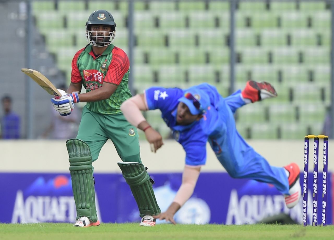 Tamim Iqbal flays the ball away from Suresh Raina, Bangladesh v India, 1st ODI, Mirpur, June 18, 2015