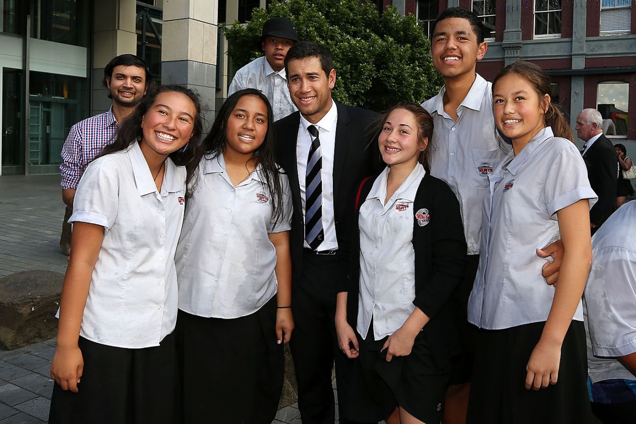 Ross Taylor poses with students of Selwyn College, Auckland, February 25, 2015