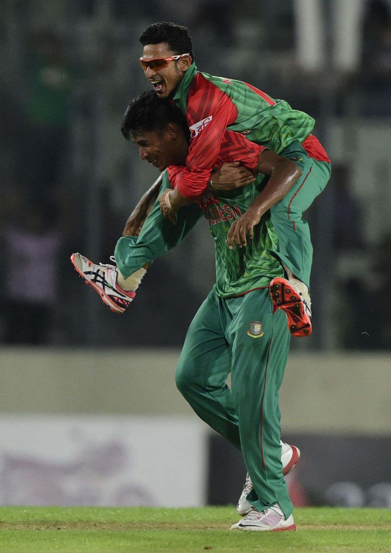 Nasir Hossain and Mustafizur Rahman celebrate the wicket of R Ashwin, Bangladesh v India, 1st ODI, Mirpur, June 18, 2015