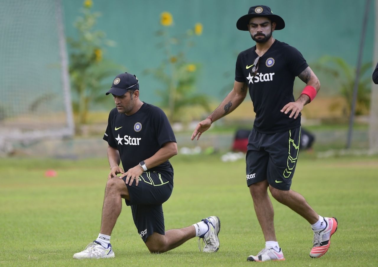 MS Dhoni and Virat Kohli stretch out in the nets, Mirpur, June 20, 2015