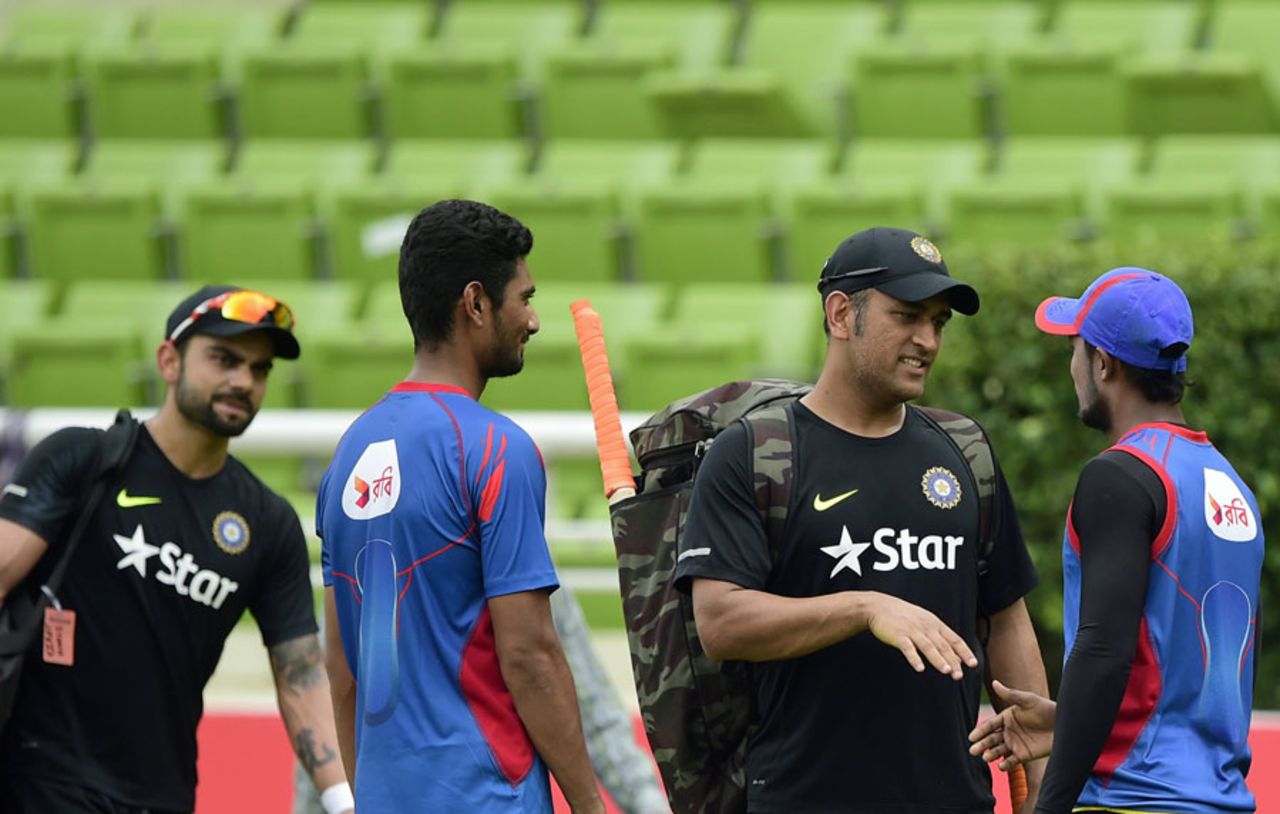 MS Dhoni has a chat with Bangladesh players Mahmudullah and Sabbir Rahman on the eve of the third ODI, Mirpur, June 23, 2015