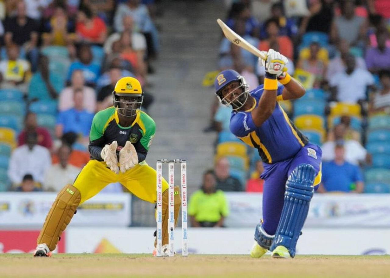 Dwayne Smith launches one down the ground, Barbados Tridents v Jamaica Tallawahs, Bridgetown, June 23, 2015