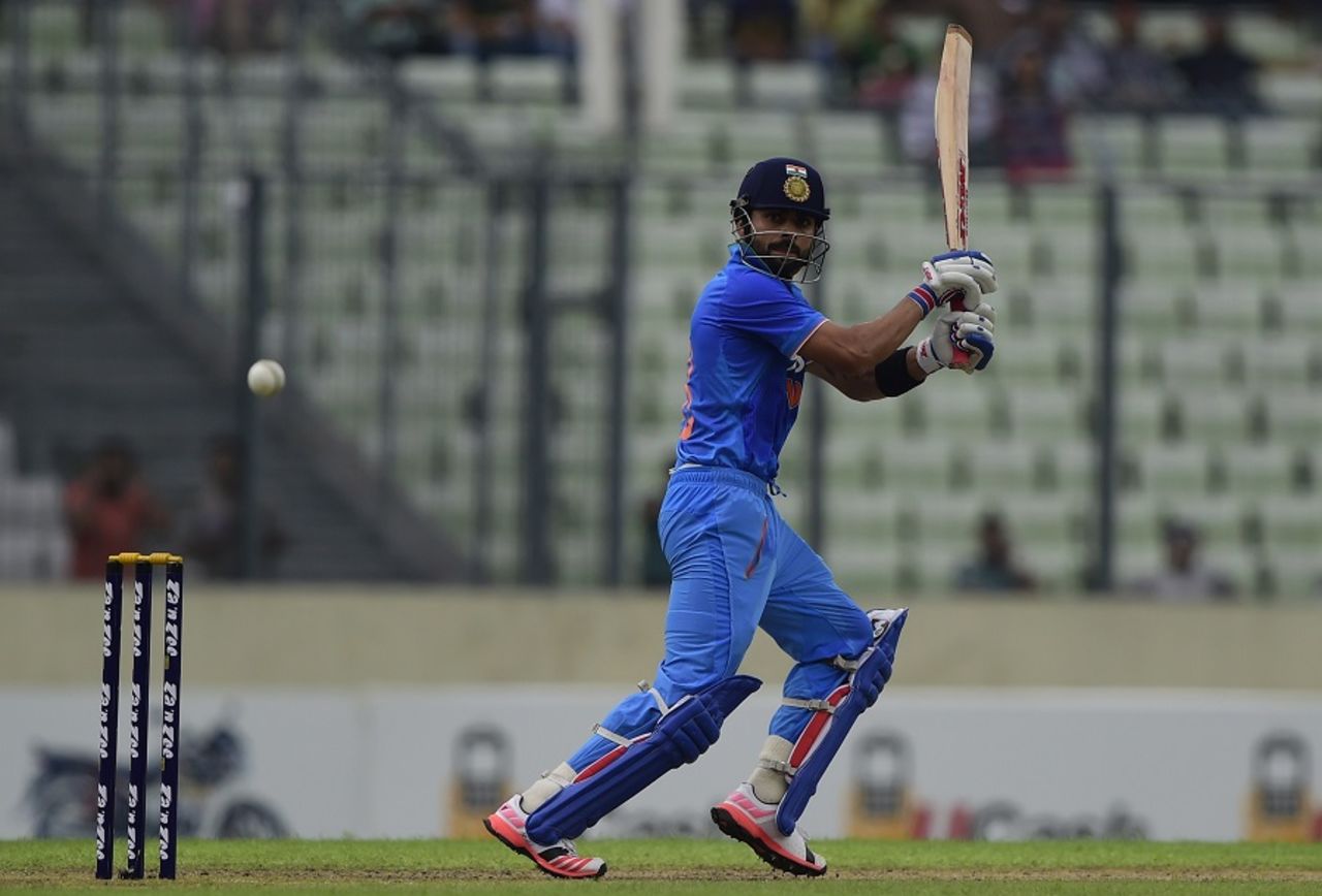 Virat Kohli flays the ball through the off side, Bangladesh v India, 3rd ODI, Mirpur, June 24, 2015