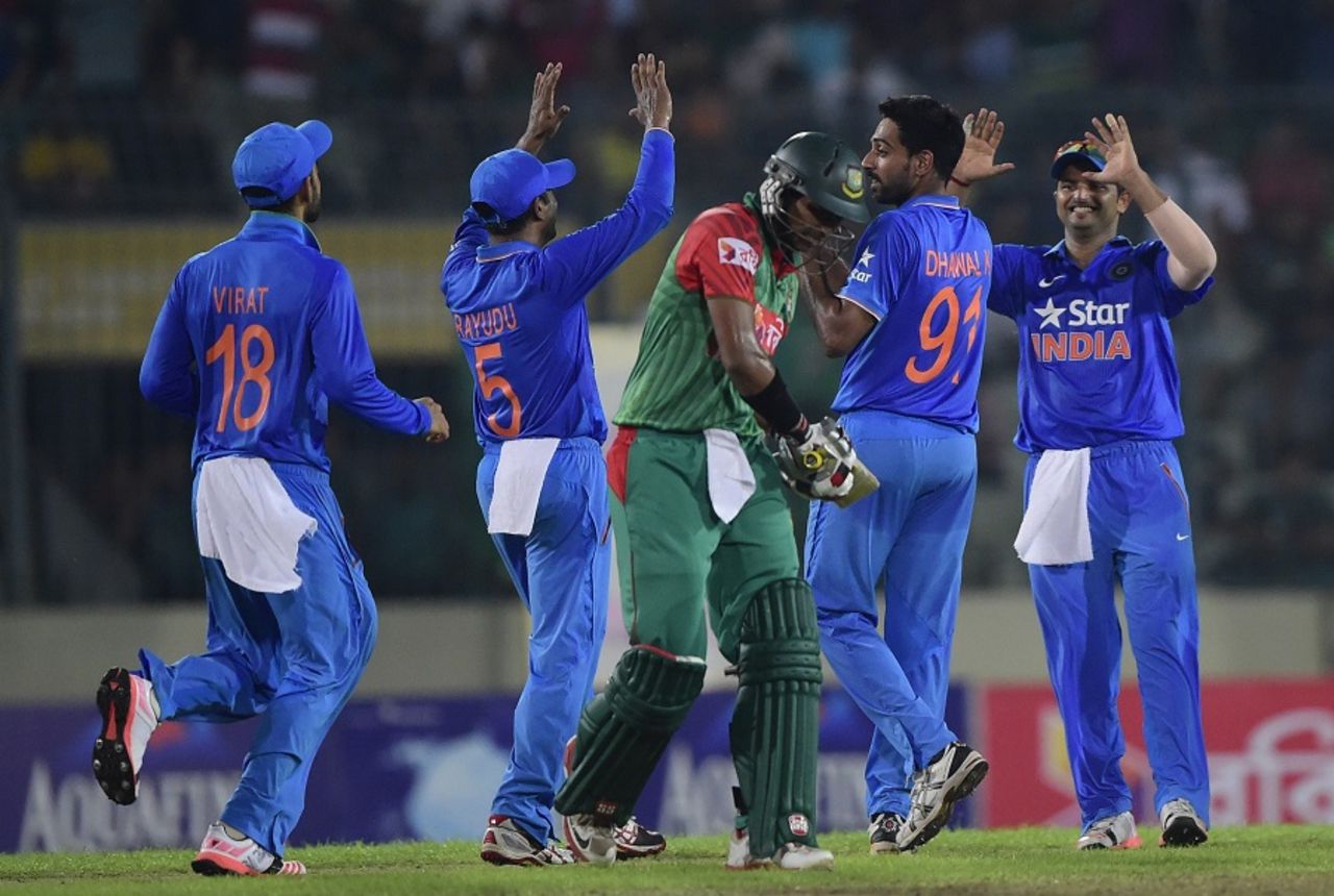 Indian fielders celebrate the dismissal of Soumya Sarkar, Bangladesh v India, 3rd ODI, Mirpur, June 24, 2015