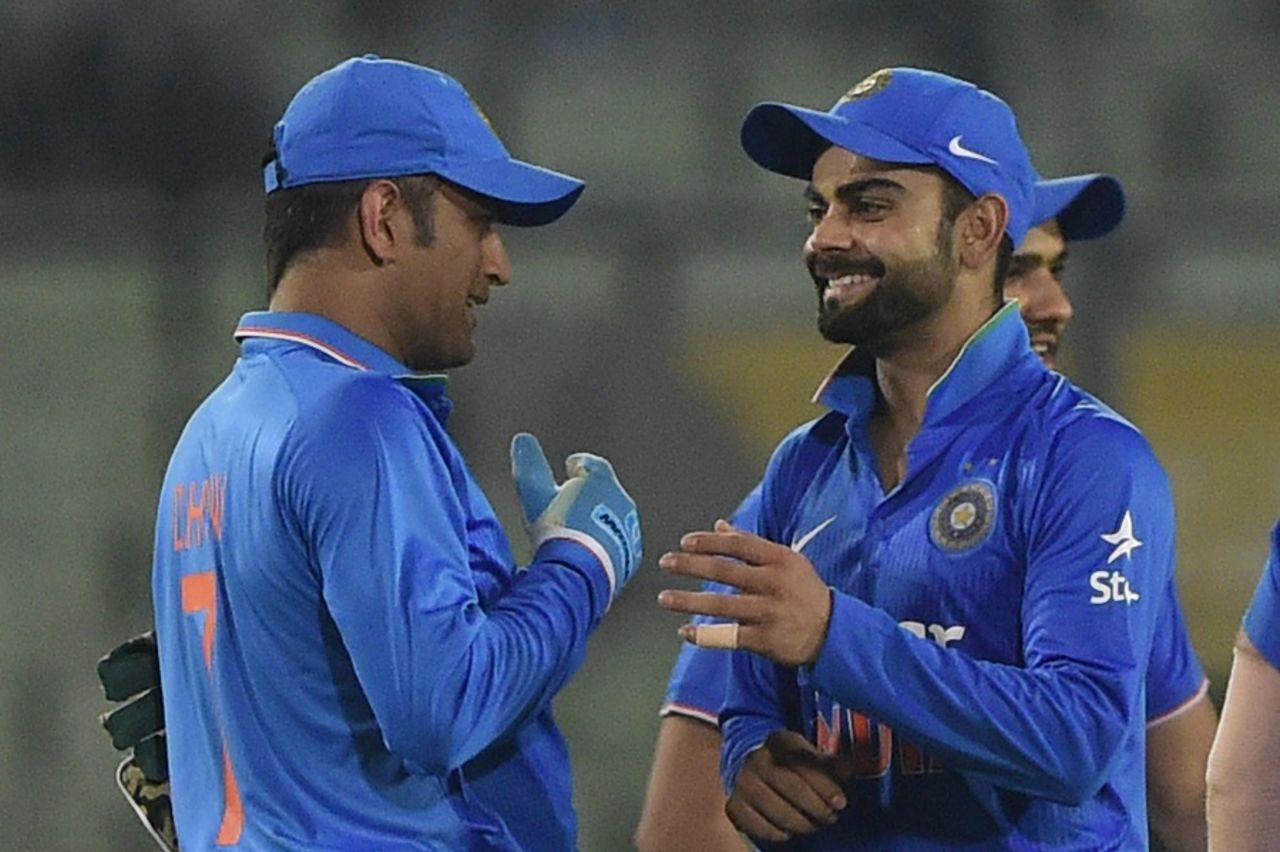 MS Dhoni and Virat Kohli share a laugh after India's win over Bangladesh, Bangladesh v India, 3rd ODI, Mirpur, June 24, 2015