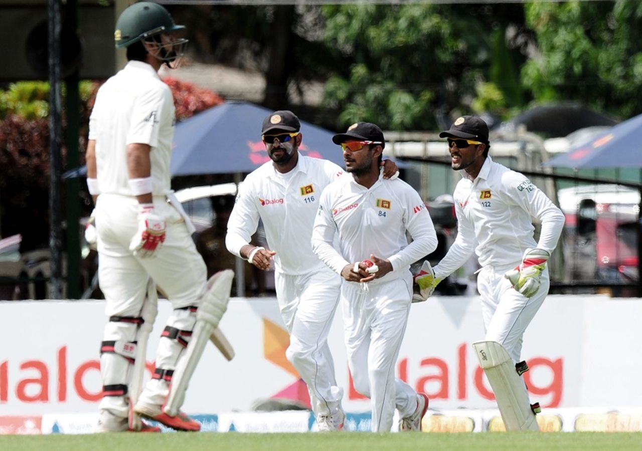 Kumar Sangakkara is greeted by his team-mates after a catch, Sri Lanka v Pakistan, 2nd Test, Colombo, June 25, 2015
