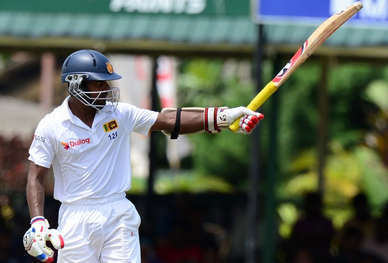 Kaushal Silva raises his bat after getting to a fifty,  Sri Lanka v Pakistan, 2nd Test, Colombo, 2nd day, June 26, 2015