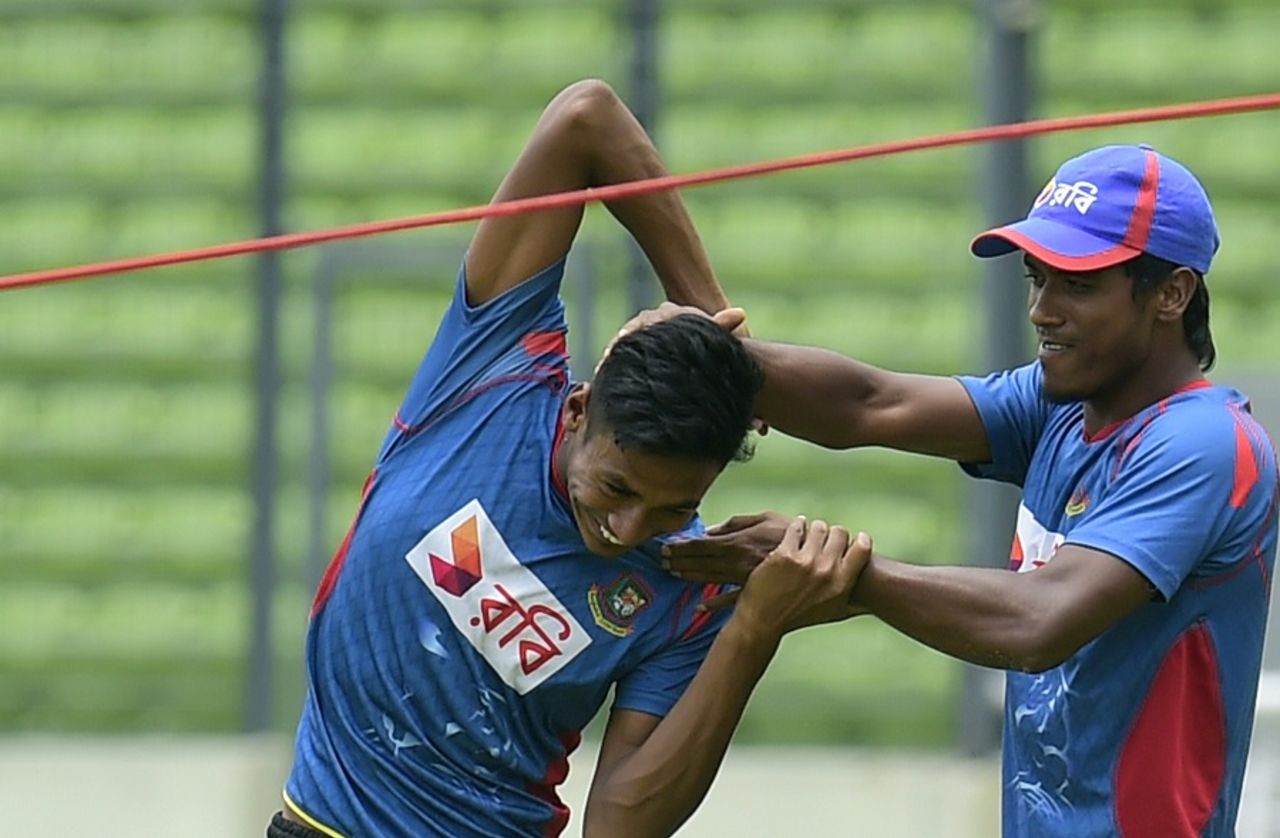 Rubel Hossain and Mustafizur Rahman share a lighter moment during Bangladesh's practice, Dhaka, July 1, 2015