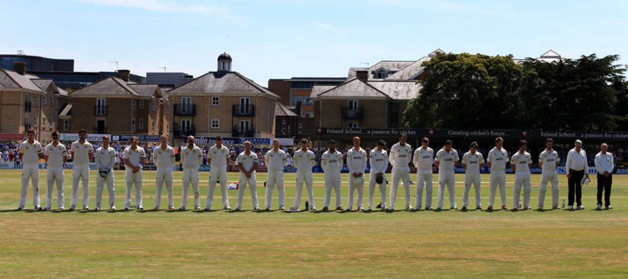 Essex and Australia players line up for a minute's silence in memory of those who lost their lives in the recent terror attack in Tunisia, Essex v Australians, Tour match, Chelmsford, 3rd day, July 3, 2015