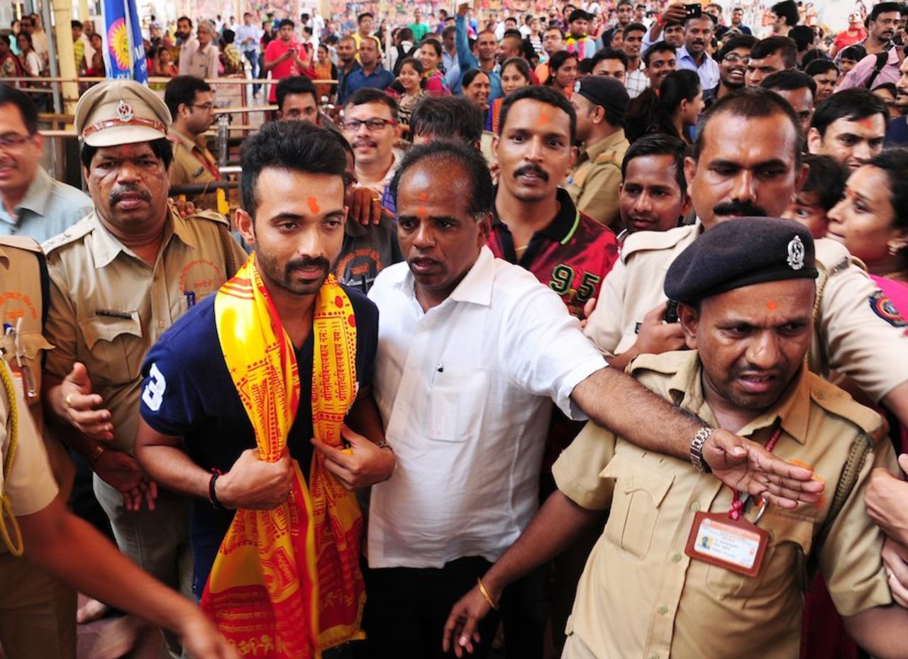 Ajinkya Rahane visits a temple in Mumbai ahead of the Indian team's departure for Zimbabwe, July 4, 2015
