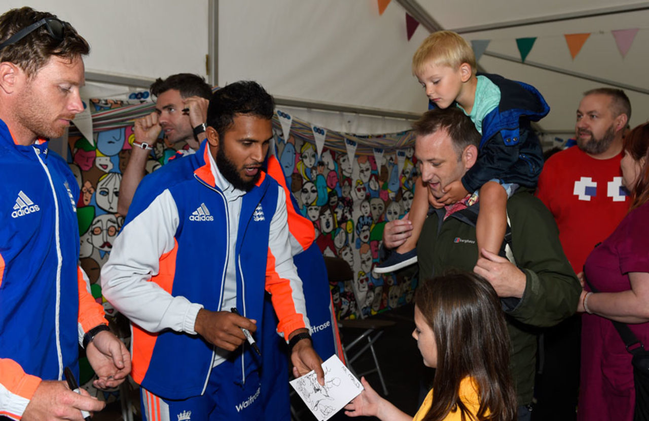 Ian Bell and Adil Rashid sign some autographs, Cardiff, July 5, 2015