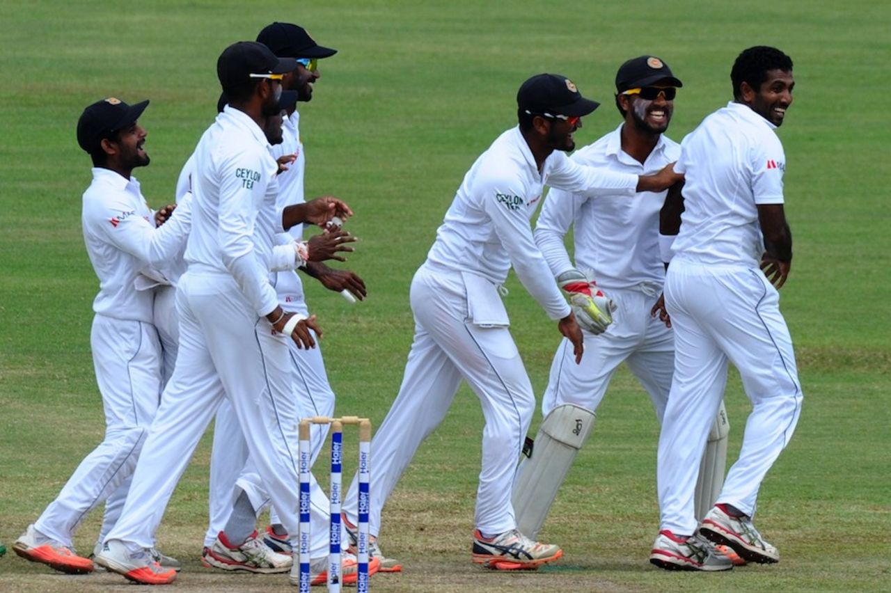 The Sri Lankans celebrate Dhammika Prasad's strike, Sri Lanka v Pakistan, 3rd Test, Pallekele, 4th day, July 6, 2015