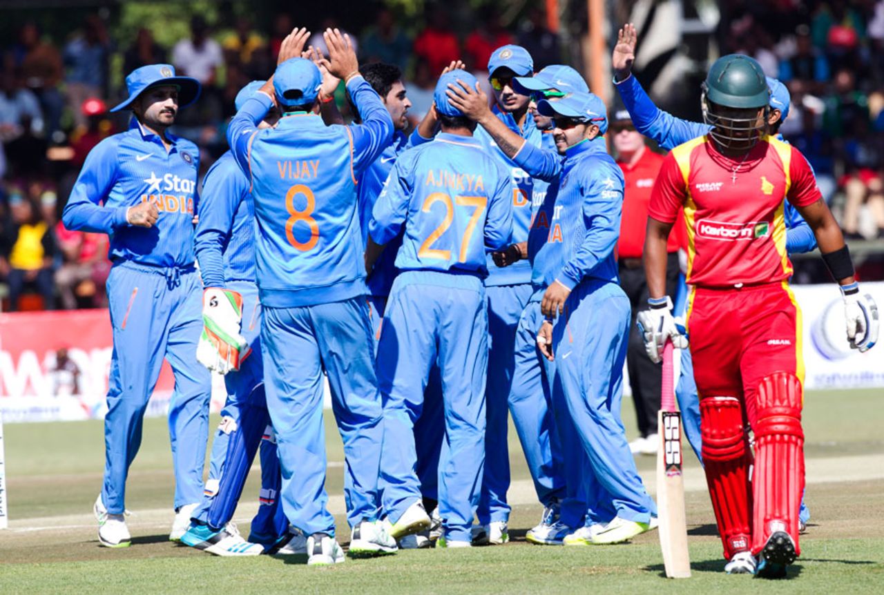 The Indian players celebrate the wicket of Chamu Chibhabha, Zimbabwe v India, 1st ODI, Harare, July 10, 2015