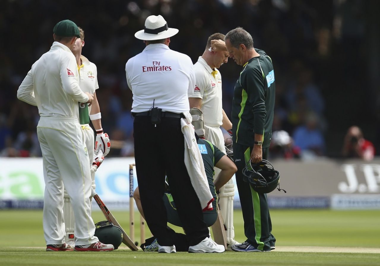 Chris Rogers gets some treatment after being struck on the helmet, England v Australia, 2nd Investec Ashes Test, Lord's, 2nd day, July 17, 2015