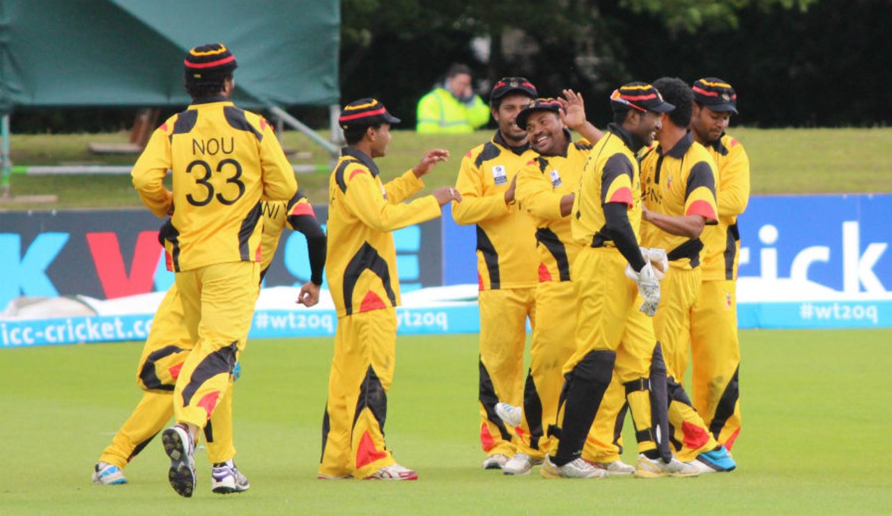 Mahuru Dai is mobbed by his team-mates, Nepal v Papua New Guinea, World T20 Qualifier, Group A, Dublin, July 17, 2015