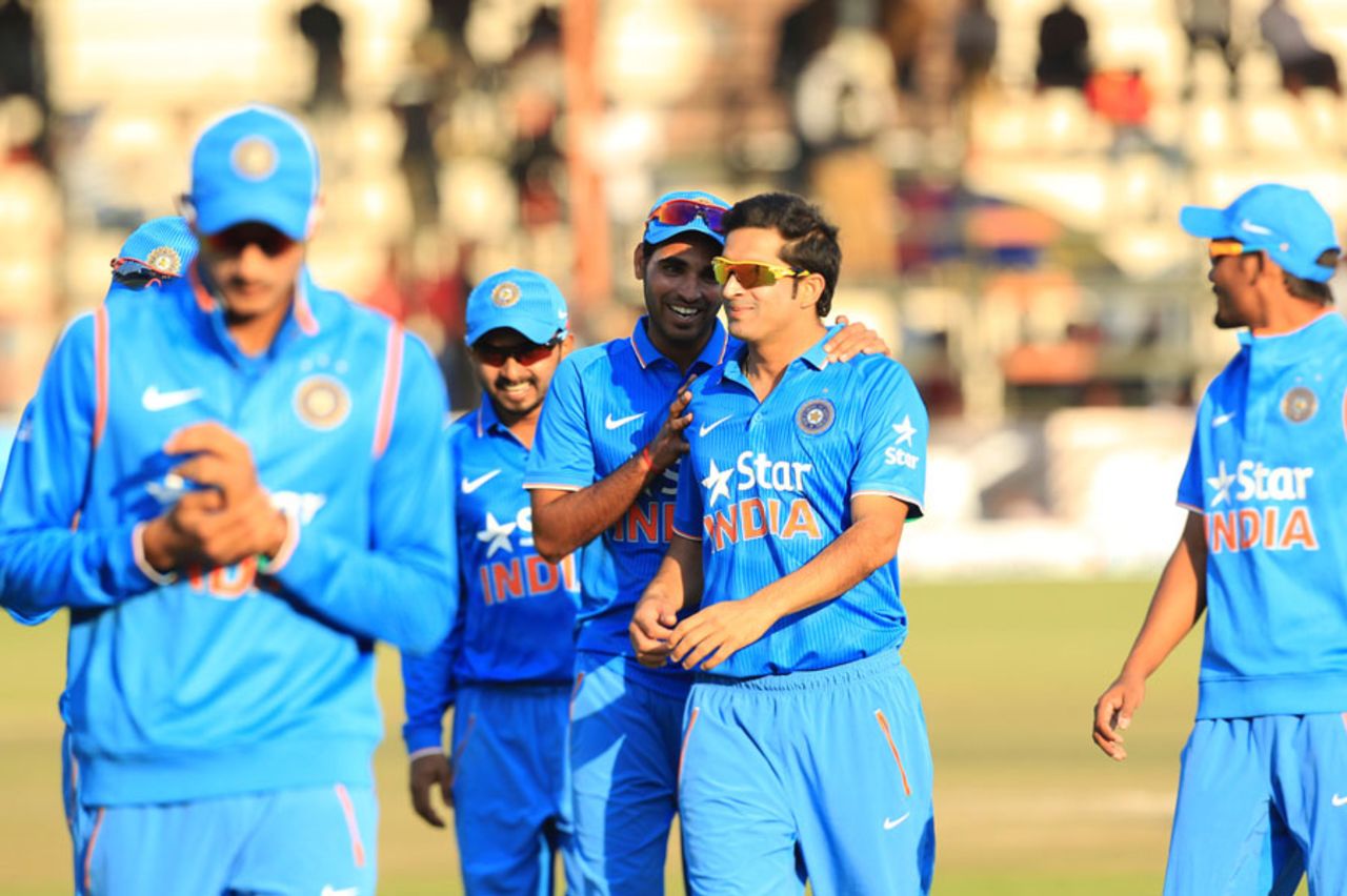 The Indian players walk off after a convincing 54-run win, Zimbabwe v India, 1st T20, Harare, July 17, 2015