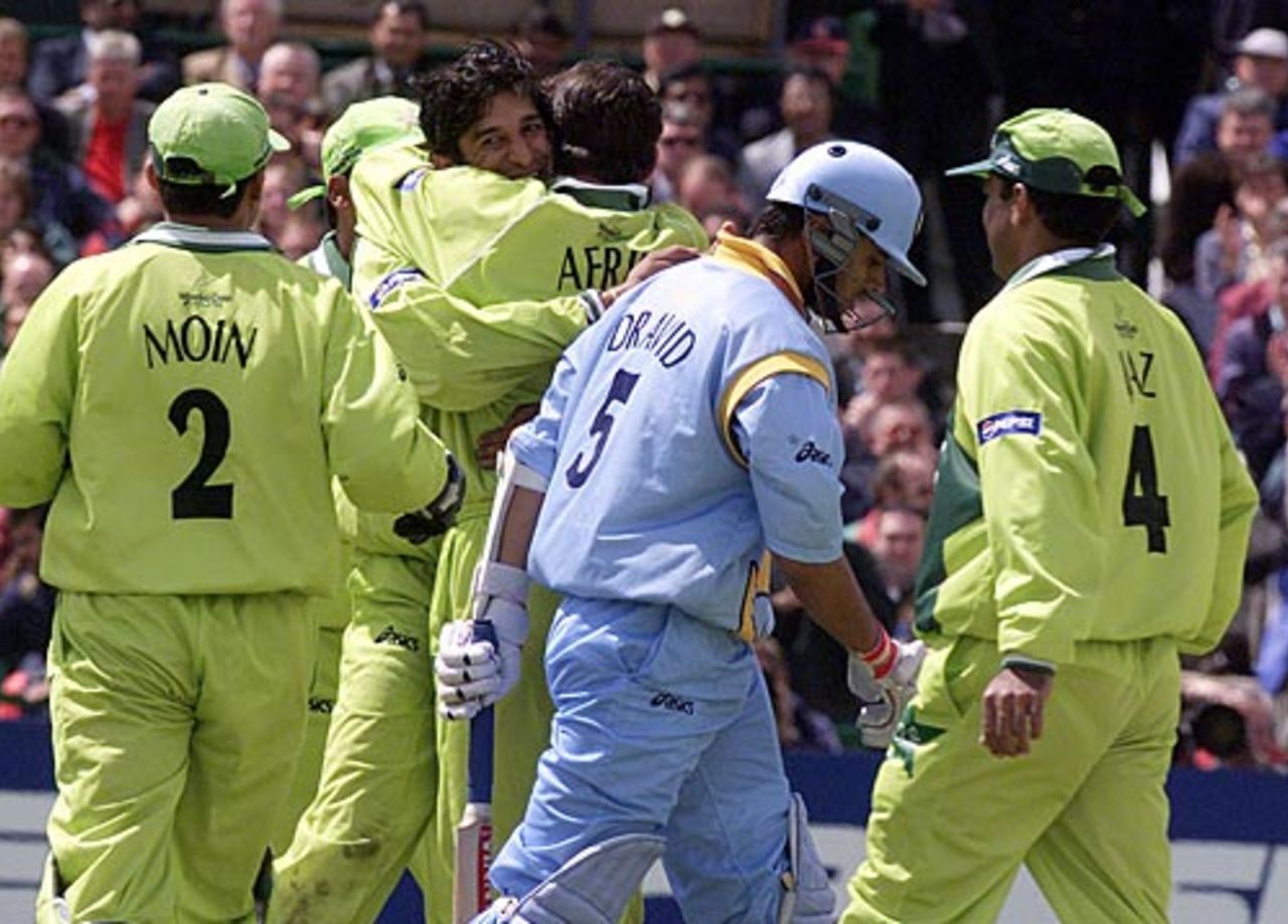 Wasim Akram is mobbed by team-mates after dismissing Rahul Dravid, India v Pakistan, Super Sixes, ICC World Cup, Manchester, June 8, 1999
