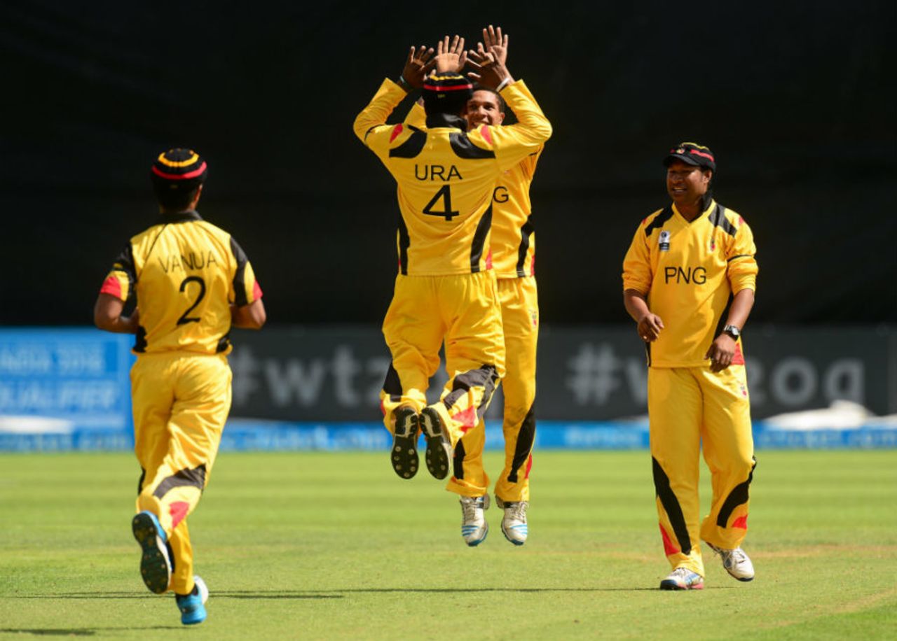 Tony Ura gets a leaping high-five from Charles Amini, Papua New Guinea v United States of America, World T20 Qulifier, Group A, Dublin, July 19, 2015