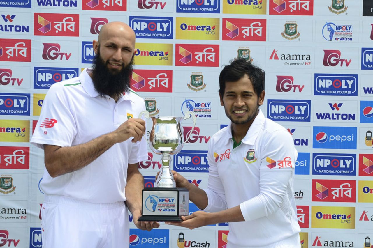 Mushfiqur Rahim and Hashim Amla pose with the trophy ahead of the first Test, Chittagong, July 20, 2015