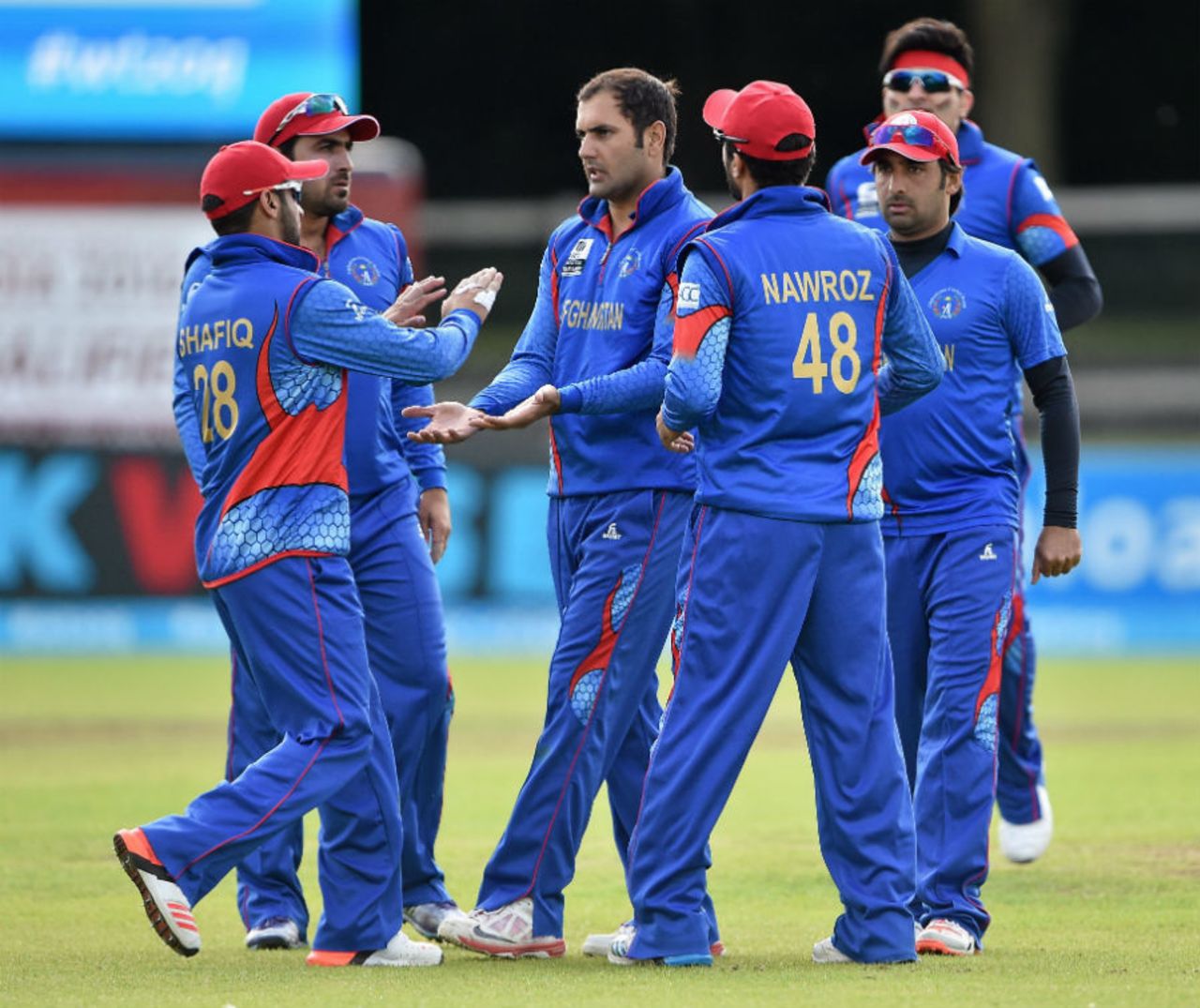 Mohammad Nabi is mobbed by his team-mates, Afghanistan v Papua New Guinea, World T20 Qualifier, 3rd Play-off, Dublin, July 23, 2015
