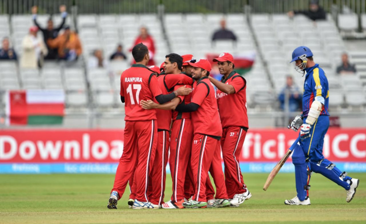 Ajay Lalcheta is mobbed by his team-mates after dismissing Gerrie Snyman, Namibia v Oman, World T20 Qualifier, Play-off, Dublin, July 23, 2015