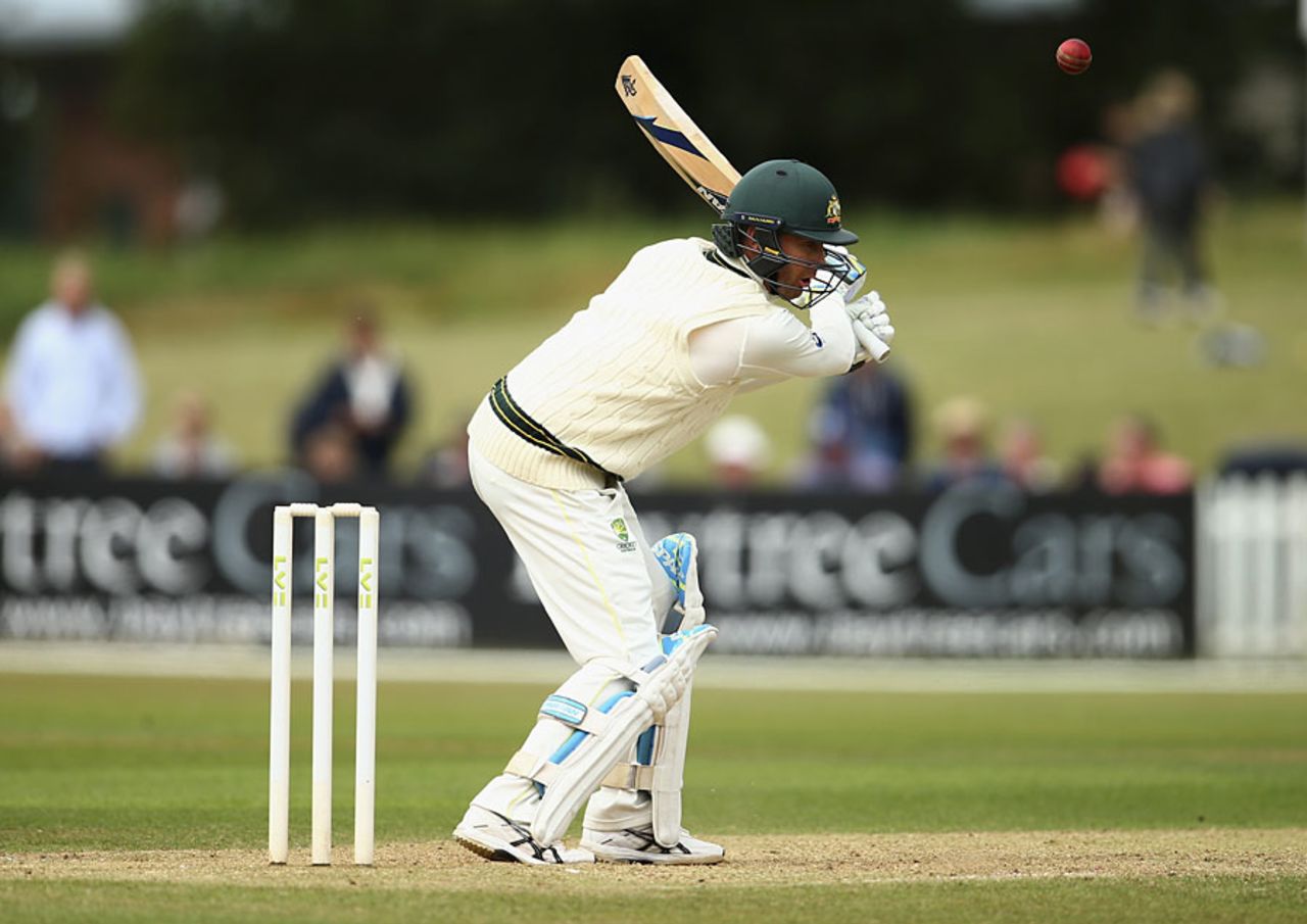 Michael Clarke reaches for a delivery, Derbyshire v Australians, Tour match, Derby, 1st day, July 23, 2015