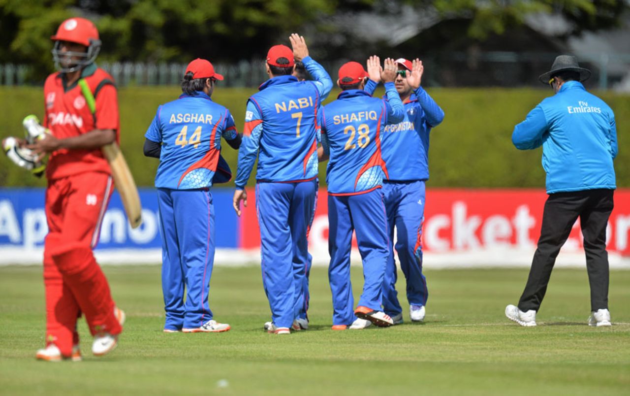 The Afghanistan players celebrate a wicket, Afghanistan v Oman, World T20 Qualifier, July 25, 2015