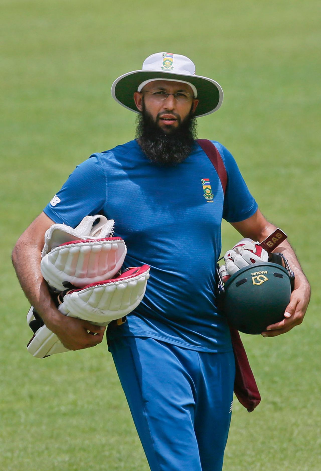 Hashim Amla carries his equipment during a training session, Dhaka, July 28, 2015