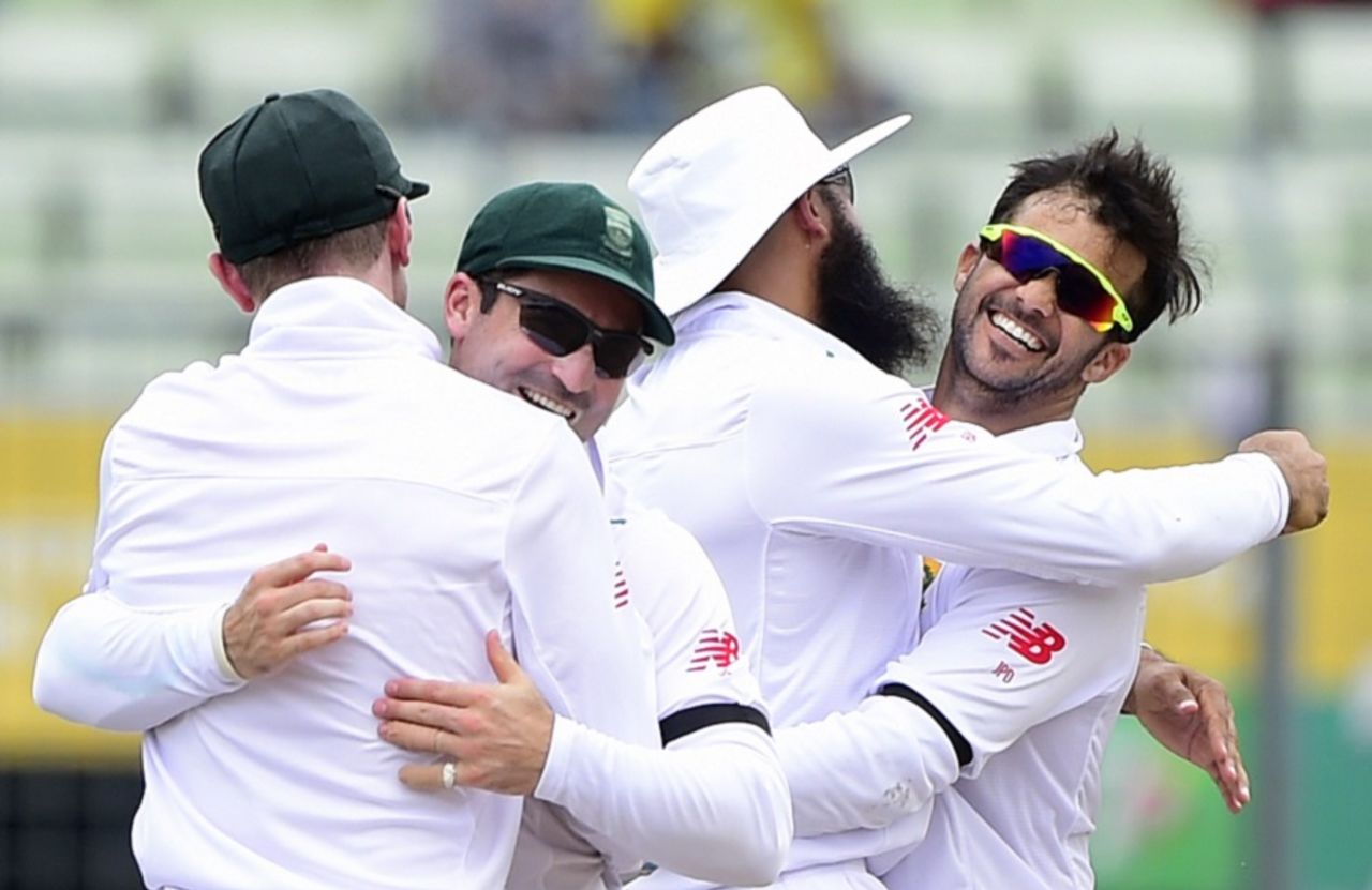 JP Duminy is congratulated by his team-mates for dismissing Mominul Haque, Bangladesh v South Africa, 2nd Test, Mirpur, 1st day, July 30, 2015