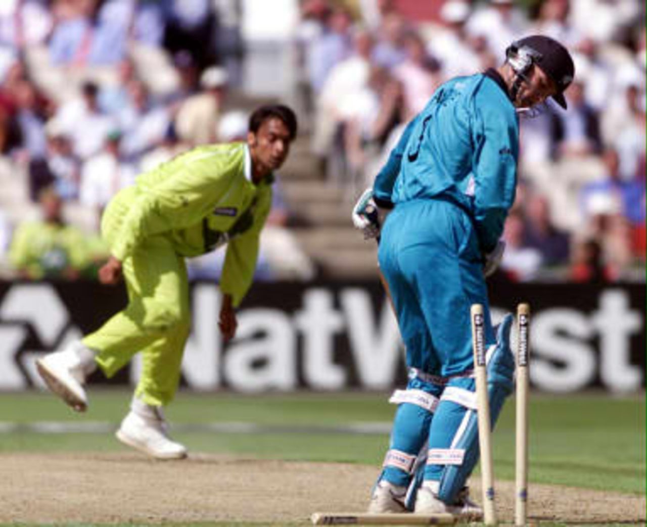 New Zealand's opening batsman Nathan Astle is bowled out, 16 June 1999, by  Pakistan's Shoaib Ahktar during their semi-final match in the Cricket World Cup at Old Trafford, Manchester. The final will be at Lords on the 20 June 99